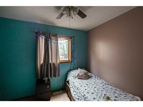 219 10 Avenue Ne, Sundre, AB - Indoor Photo Showing Bedroom