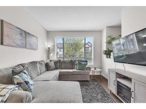 43 Copperpond Close Se, Calgary, AB - Indoor Photo Showing Living Room