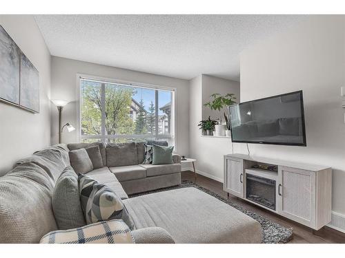 43 Copperpond Close Se, Calgary, AB - Indoor Photo Showing Living Room