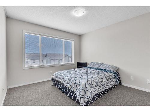 43 Copperpond Close Se, Calgary, AB - Indoor Photo Showing Bedroom