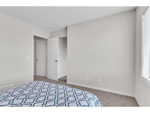 43 Copperpond Close Se, Calgary, AB - Indoor Photo Showing Bedroom