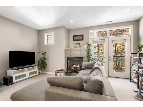 164 9 Street Ne, Calgary, AB - Indoor Photo Showing Living Room With Fireplace