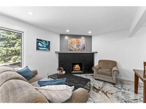 19-4940 39 Avenue Sw, Calgary, AB - Indoor Photo Showing Living Room With Fireplace