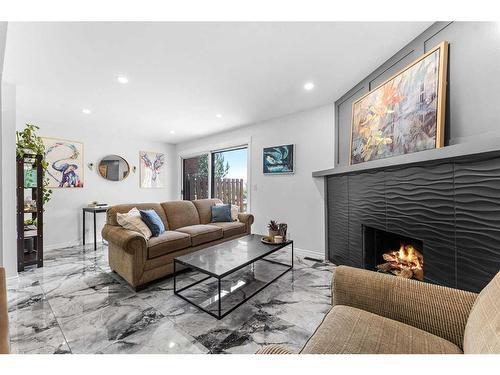 19-4940 39 Avenue Sw, Calgary, AB - Indoor Photo Showing Living Room With Fireplace