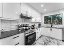 19-4940 39 Avenue Sw, Calgary, AB  - Indoor Photo Showing Kitchen With Stainless Steel Kitchen With Upgraded Kitchen 