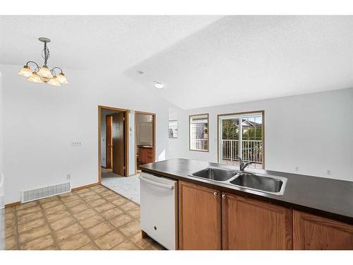 603 Country Village Cape Ne, Calgary, AB - Indoor Photo Showing Kitchen With Double Sink