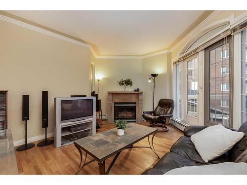 104-1315 12 Avenue Sw, Calgary, AB - Indoor Photo Showing Living Room With Fireplace