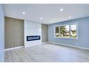 1615 Rouleau Crescent Se, Calgary, AB  - Indoor Photo Showing Living Room With Fireplace 