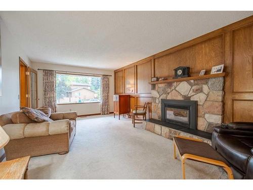 1511 Varsity Estates Drive Nw, Calgary, AB - Indoor Photo Showing Living Room With Fireplace