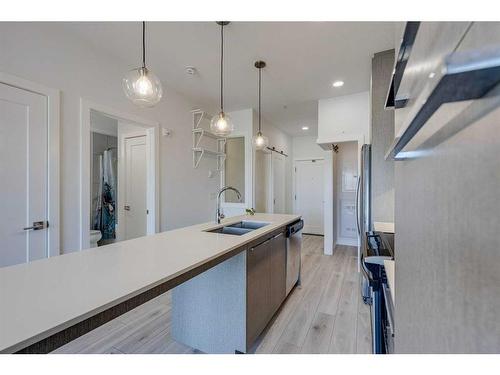 1131-76 Cornerstone Passage Ne, Calgary, AB - Indoor Photo Showing Kitchen With Double Sink