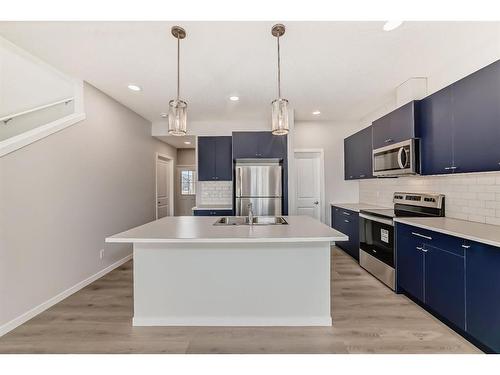 1485 Bayview Point, Airdrie, AB - Indoor Photo Showing Kitchen With Upgraded Kitchen