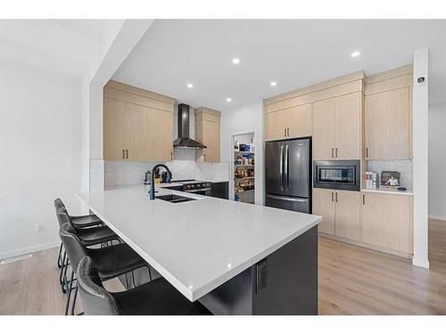 58 Seton Road Se, Calgary, AB - Indoor Photo Showing Kitchen With Double Sink