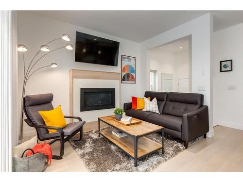 2-1913 30 Street Sw, Calgary, AB - Indoor Photo Showing Living Room With Fireplace