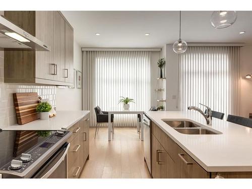 2-1913 30 Street Sw, Calgary, AB - Indoor Photo Showing Kitchen With Double Sink With Upgraded Kitchen