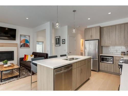 2-1913 30 Street Sw, Calgary, AB - Indoor Photo Showing Kitchen With Double Sink With Upgraded Kitchen