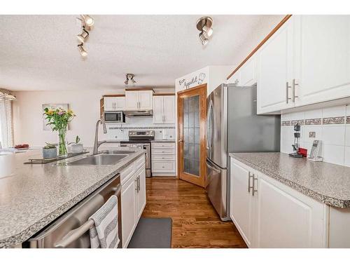 15225 Prestwick Boulevard Se, Calgary, AB - Indoor Photo Showing Kitchen With Double Sink