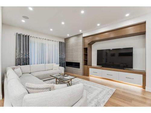 500 30 Avenue Ne, Calgary, AB - Indoor Photo Showing Living Room With Fireplace