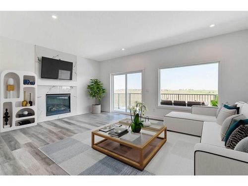 194 Muirfield Boulevard, Lyalta, AB - Indoor Photo Showing Living Room With Fireplace