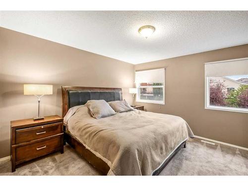 170 Rocky Ridge Point Nw, Calgary, AB - Indoor Photo Showing Bedroom