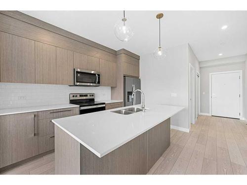 1406-60 Skyview Ranch Road Ne, Calgary, AB - Indoor Photo Showing Kitchen With Stainless Steel Kitchen With Double Sink With Upgraded Kitchen