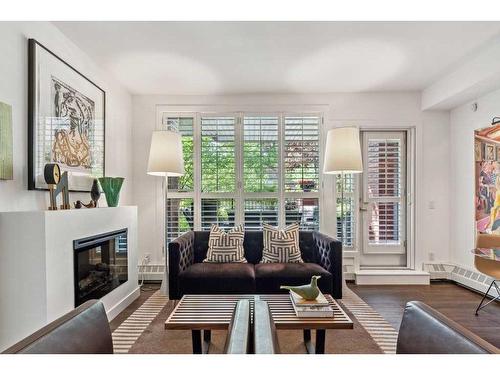 109-1730 5A Street Sw, Calgary, AB - Indoor Photo Showing Living Room With Fireplace