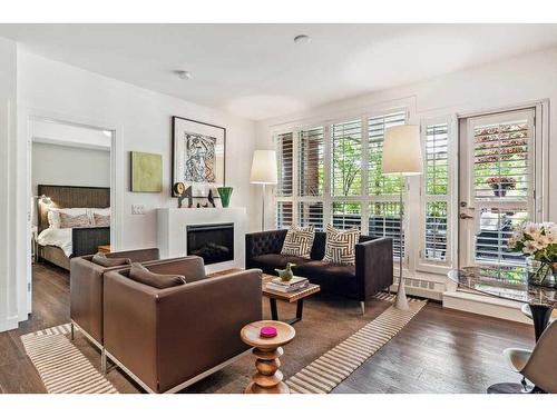 109-1730 5A Street Sw, Calgary, AB - Indoor Photo Showing Living Room With Fireplace