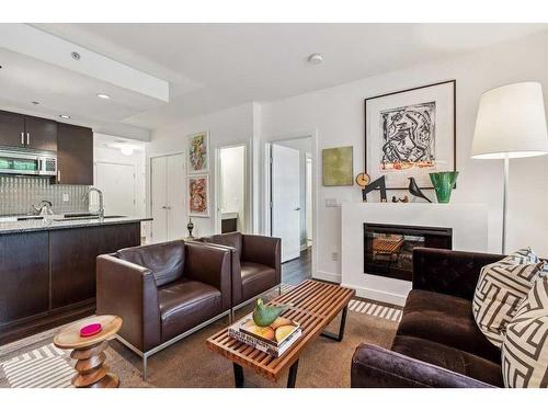 109-1730 5A Street Sw, Calgary, AB - Indoor Photo Showing Living Room With Fireplace