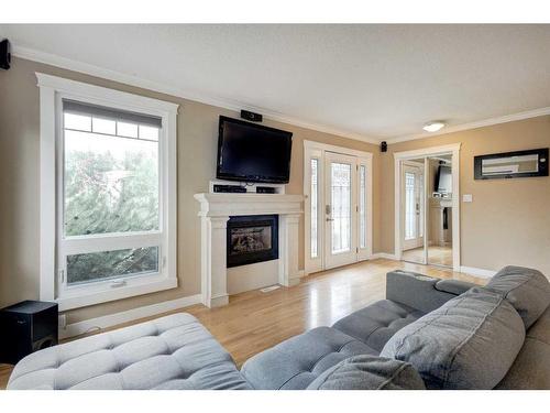 4820 41 Avenue Sw, Calgary, AB - Indoor Photo Showing Living Room With Fireplace