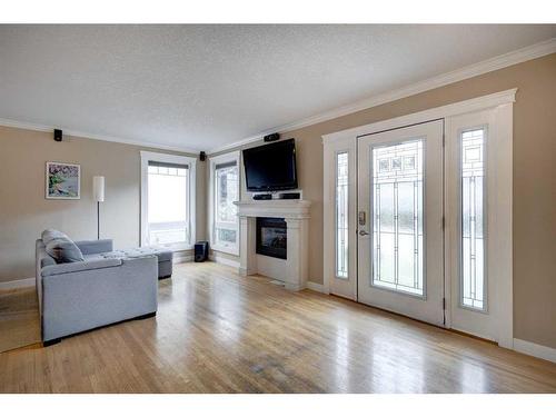 4820 41 Avenue Sw, Calgary, AB - Indoor Photo Showing Living Room With Fireplace