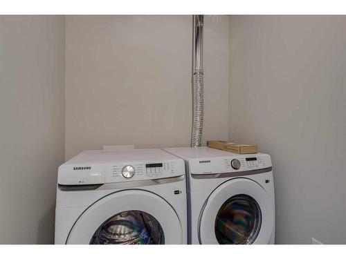 101-50 Sage Hill Walk Nw, Calgary, AB - Indoor Photo Showing Laundry Room