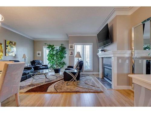 323 Shannon Estates Terrace Sw, Calgary, AB - Indoor Photo Showing Living Room With Fireplace