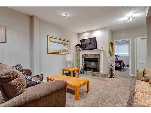 323 Shannon Estates Terrace Sw, Calgary, AB - Indoor Photo Showing Living Room With Fireplace