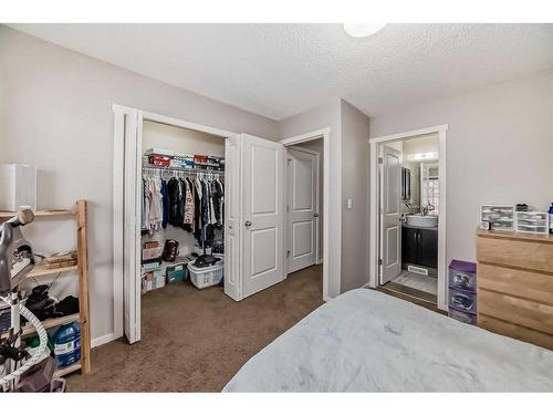 1610-125 Panatella Way Nw, Calgary, AB - Indoor Photo Showing Bedroom