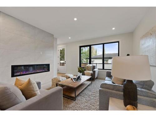 4608 82 Street Nw, Calgary, AB - Indoor Photo Showing Living Room With Fireplace