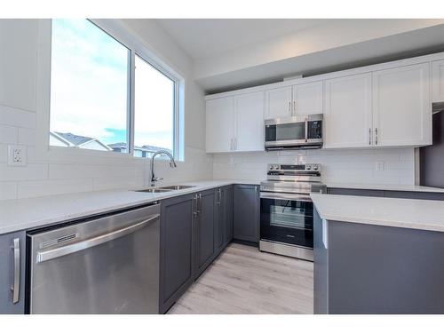 94 Edith Green Nw, Calgary, AB - Indoor Photo Showing Kitchen With Double Sink