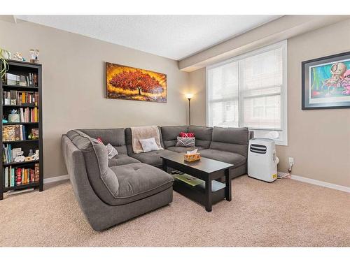 114 New Brighton Landing Se, Calgary, AB - Indoor Photo Showing Living Room