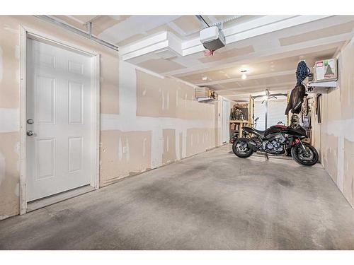 114 New Brighton Landing Se, Calgary, AB - Indoor Photo Showing Garage