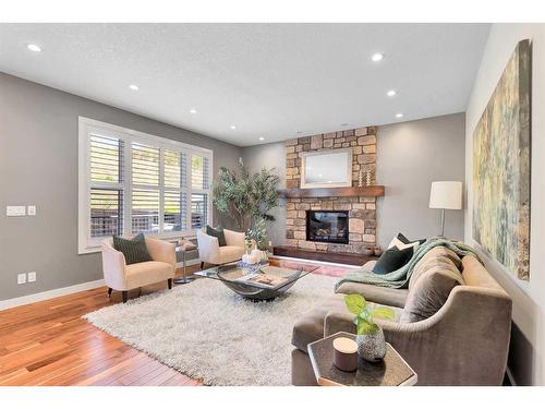 91 Cranbrook Crescent Se, Calgary, AB - Indoor Photo Showing Living Room With Fireplace