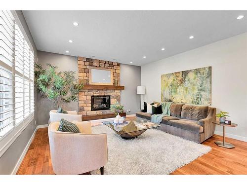 91 Cranbrook Crescent Se, Calgary, AB - Indoor Photo Showing Living Room With Fireplace