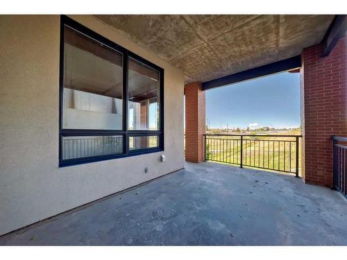 209-8710 Horton Road Sw, Calgary, AB - Indoor Photo Showing Garage