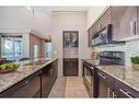 209-8710 Horton Road Sw, Calgary, AB  - Indoor Photo Showing Kitchen With Double Sink 