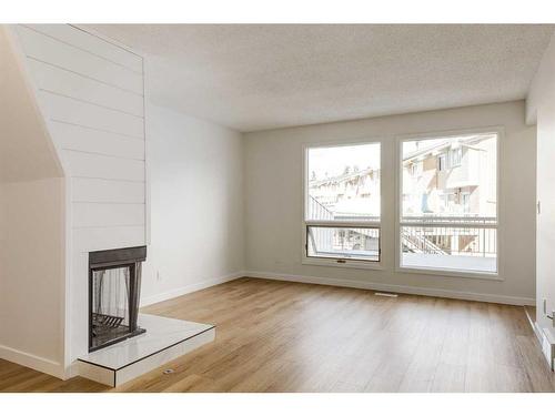 49-116 Silver Crest Drive Nw, Calgary, AB - Indoor With Fireplace