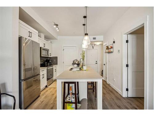 4111-200 Seton Circle Se, Calgary, AB - Indoor Photo Showing Kitchen With Stainless Steel Kitchen With Double Sink With Upgraded Kitchen