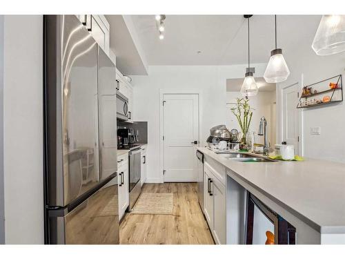 4111-200 Seton Circle Se, Calgary, AB - Indoor Photo Showing Kitchen With Stainless Steel Kitchen With Upgraded Kitchen