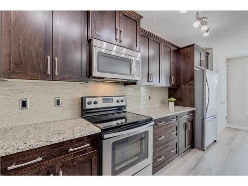 128 Copperpond Parade Se, Calgary, AB - Indoor Photo Showing Kitchen With Upgraded Kitchen