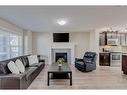 128 Copperpond Parade Se, Calgary, AB  - Indoor Photo Showing Living Room With Fireplace 