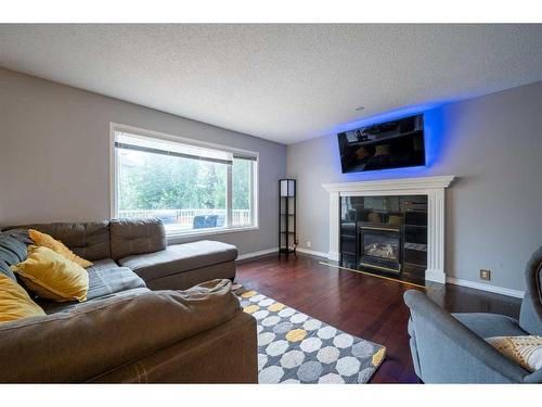 76 Chaparral Road Se, Calgary, AB - Indoor Photo Showing Living Room With Fireplace