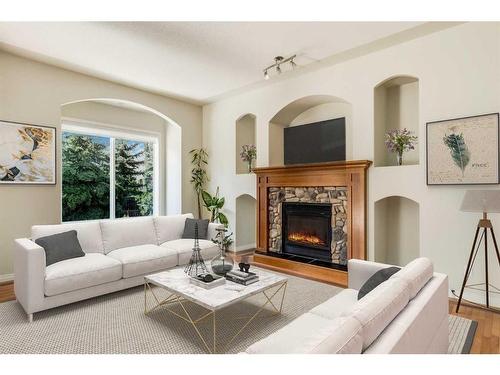 133 Tusslewood Heights Nw, Calgary, AB - Indoor Photo Showing Living Room With Fireplace