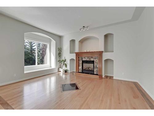 133 Tusslewood Heights Nw, Calgary, AB - Indoor Photo Showing Living Room With Fireplace