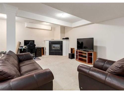 133 Tusslewood Heights Nw, Calgary, AB - Indoor Photo Showing Living Room With Fireplace